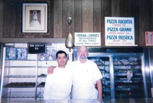 Pictured are Juan Lopez (left) and Thomas Caruso (right) in the storefront of Conca D'Oro Italian Pastry Shop in Union, NJ. 